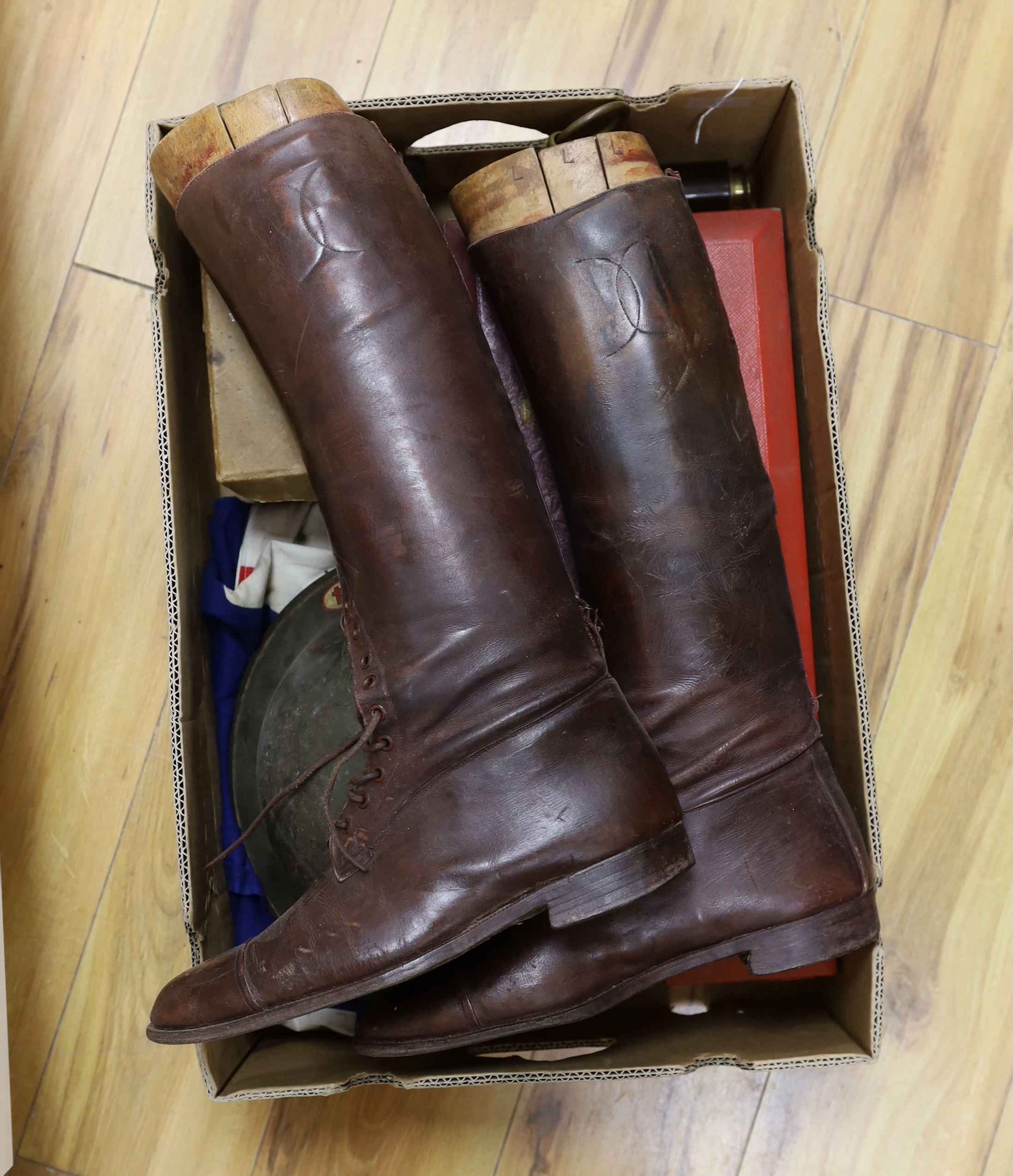 A collection of militaria, including; a pair of First World War military leather boots with wooden boot stretchers, two scroll boxes with Royal Cyphers for George V and Elizabeth II, a four draw telescope, a large union